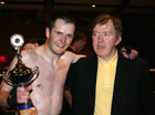 Marty (left) was presented with his bout trophy by keen kickboxing fan and Irish TD John Perry who was in Canada on business.