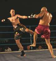 Mark lands a low kick