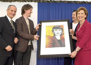 Daryl Campbell presents President Mary McAleese with a portrait