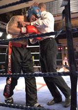 Ref Carl Emery stops the fight