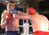 Alan Thomas lands a good jab and was dangerous right to the final bell