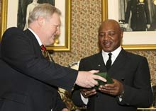 Belfast Lord Mayor presents Boxing legend marvin Hagler with a gift at the City Hall