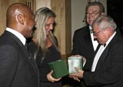 Mr & Mrs Hagler are presented with a memento  of Belfast 