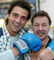 Pop Idol Darius lands one on the chin of former world champion Billy Murray