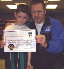 Matthew Salmon passes his junior blue belt - just one belt behind his Dad  , Eddie a proKick instructor