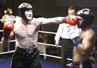 Darren Dougan lands a punch square on the face of Steve Peatrie