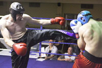 Dungannon fighter Gareth Williamson kicks out against Aberdeens Steve Cauldwell