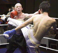 Stuart Jess counters a kick from the Cocky Aberdeen fighter Alexander White