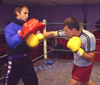 Ian Young takes Rafa on the pads