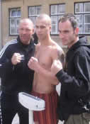 Promoter Kai Guttman (LEFT) Barrie Oliver on the scales and coach Ian Young