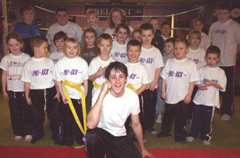 Alexander teaching the kids some of high flying kicks before sparring with world champion Gary Hamilton