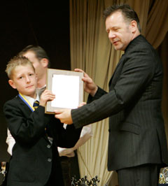 Ashfield pupils receive their awards from former student Billy Murray