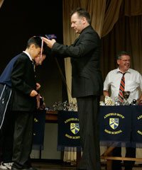 Ashfield pupils receive their awards from former student Billy Murray