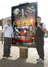 Gary and White with the Billboard of the event in Toulouse France