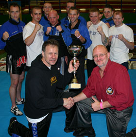 The Northern irish squad receive their runner up trophy with event promoter and WKN rep Wolfgang Geir