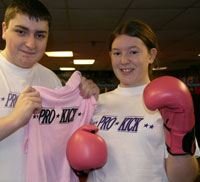 Alan presents Natasha with gloves and t.shirt