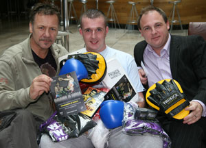 Pictured here with winner DJ Darryn McCallion, is promoter of the ‘Brawl On The Wall’ Billy Murray, a four-weight world champion and Ireland’s most successful kickboxer. And (Right) is Millennium Forum manager Mr Paul Mason.