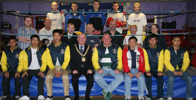 Belfast’s Lord Mayor takes centre stage with the visiting team from Hong Kong as Prokick fighters bring up the rear,