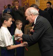 Local councillor Jim Rodgers presents young ProKick member with momento of day