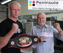 Darren McMullan pictured here with local business entrepreneur Mr Gary Withers owner of Peninsula print in Newtownards, tickets in hand.