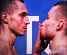 At the weight-ins: Carl Frampton blows a kiss to Scott Quigg ahead of their IBF and WBA super-bantamweight clash in Manchester Arena