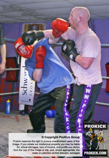 Paul McClintock squares up against Stuart Jess and takes a right hand on the chin.