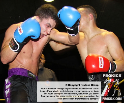 Karl McBlain takes a solid shot from Swiss fighter Omar Touiki