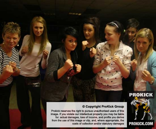The group from Loughsore school pictured with their teachers at the ProKick kickboxing gym in east Belfast