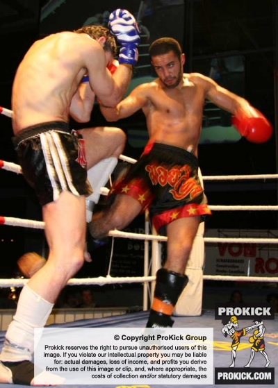 Jamal Wahib from France in action in kickboxing Switzerland - lands his own hard low kicks to Belfast's Ian Young