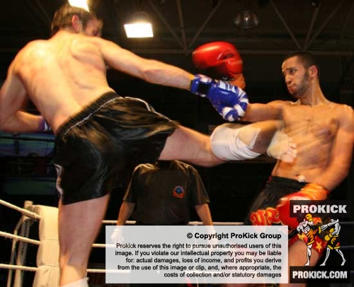 Ian Young was kick high in Kickboxing action in Switzerland against Jamal Wahib of France