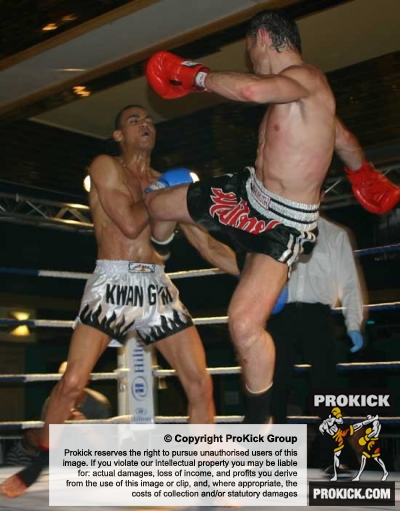 Ian Young (Right) lands a hard jumping roundhouse kick to Bosompen