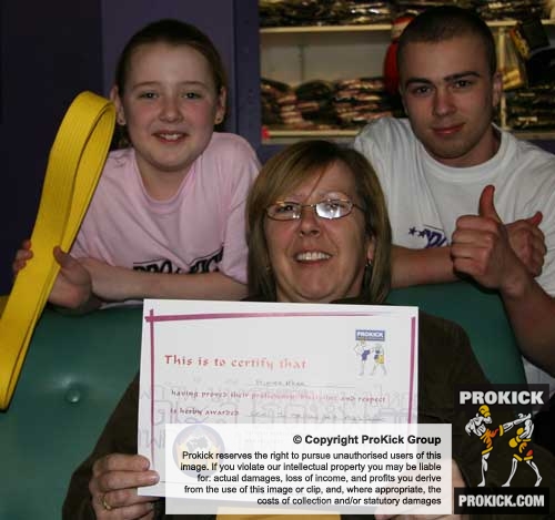 Prokick kickboxing instructor Barrie Oliver give the thumbs up to 9 year old Aimee McKee and also to her mum for encouraging Aimee in the sport of kickboxing