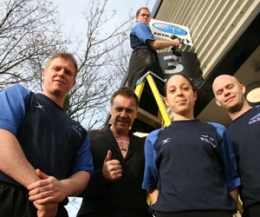 L-R Mark Henry, Billy Murray and Adele Doran and Andrew Belshaw look on whilst Stevie McGuigan is up on the ladder adding the finishing touches to Well-Fit