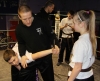 Saskia Connolly and Leith Braiden being assessed on their self defence techniques by senior member of the ProKick team and Instructor Gary Fullerton.