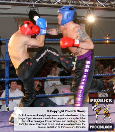 Adriam moat counters a kick from Swiss fighter Boscarino