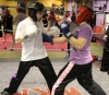ProKick member Christine Miller punches out on the last week of ProKick HQ's beginner sparring course.