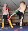 ProKick fighter Stuart Jess takes a hard low kick from Bo DelBressine from Malta.