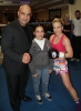 ProKick fighter Ursula Agnew's opponent Maria Pantazi with WKN Official and young fan after the event in Nicosia, Cyprus on 9th March 2012.
