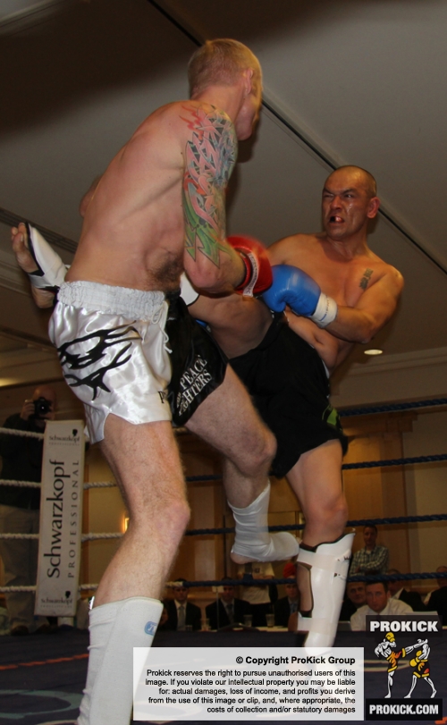 ProKick fighter Darren McMullan takes a hard roundhouse kick from opponent Barry Haberland from Holland.