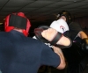James Gillen kicks high to the head of Greig Anderson during a hard sparring come fight contest