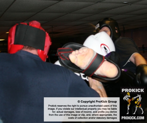 James Gillen kicks high to the head of Greig Anderson during a hard sparring come fight contest