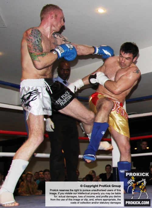ProKick's Darren McMullan lands a low kick on opponent Chris Lovell during their K1 style match on 25th February 2012 in Staines, Essex.