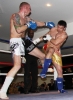 ProKick's Darren McMullan lands a low kick on opponent Chris Lovell during their K1 style match on 25th February 2012 in Staines, Essex.