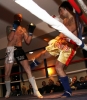 ProKick's Darren McMullan absorbs a low kick from opponent Chris Lovell during their K1 style match on 25th February 2012 in Staines, Essex.