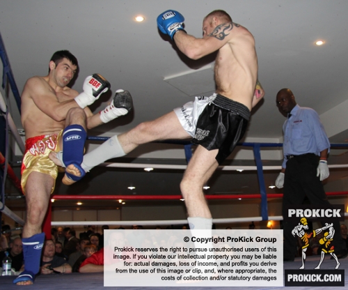 ProKick's Darren McMullan lands another hard low kick on opponent Chris Lovell during their K1 style match on 25th February 2012 in Staines, Essex.