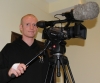 Injured ProKick fighter Darren McMullan working the video camera at the event in Nicosia, Cyprus on 9th March 2012.