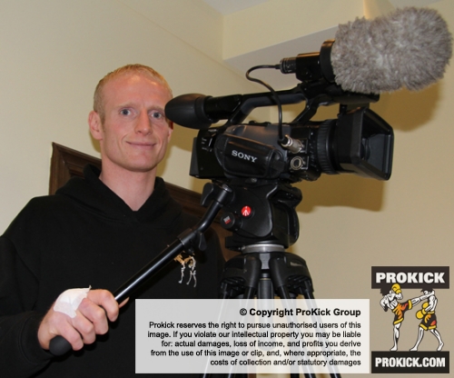 Injured ProKick fighter Darren McMullan working the video camera at the event in Nicosia, Cyprus on 9th March 2012.