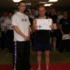 Prokicks Shankill Kickboxing instructor Barrie Oliver with Carrickfergus' new yellow belt David Mitchell