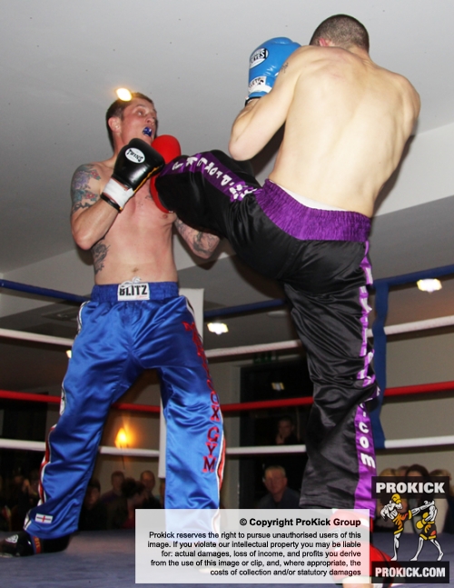 ProKick's Davy Foster lands a hard front kick on opponent Scott Bryant on 25th February 2012 in Staines, Essex.