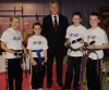 Saskia Connolly, Jamie Phillips and Kyle Morrison alongside Tegan Keers show off their new Black Belts presented to them by Northern Ireland First Minister Peter Robinson.